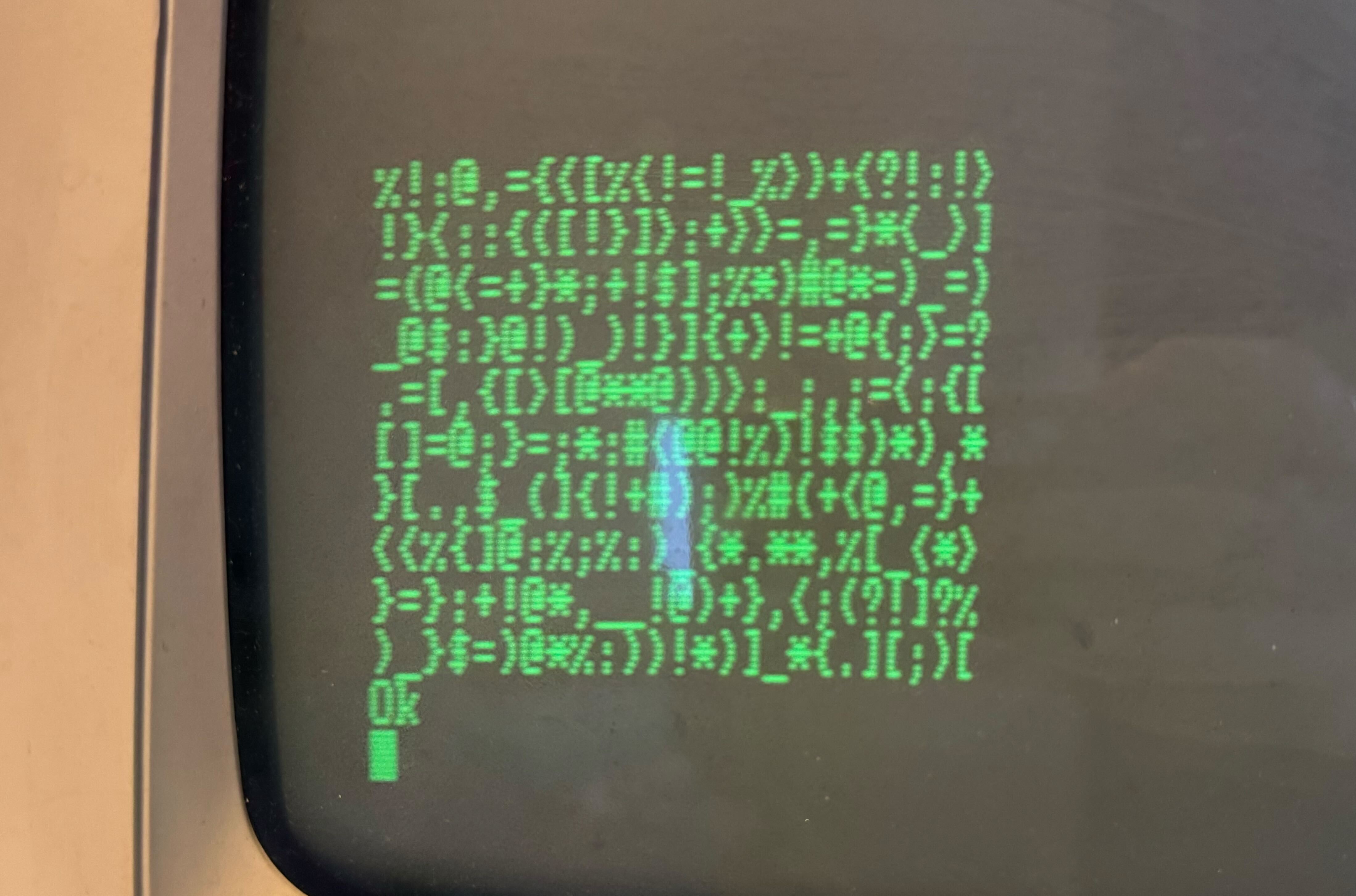 Green text on a black background showing 10 lines of 25 random characters each.