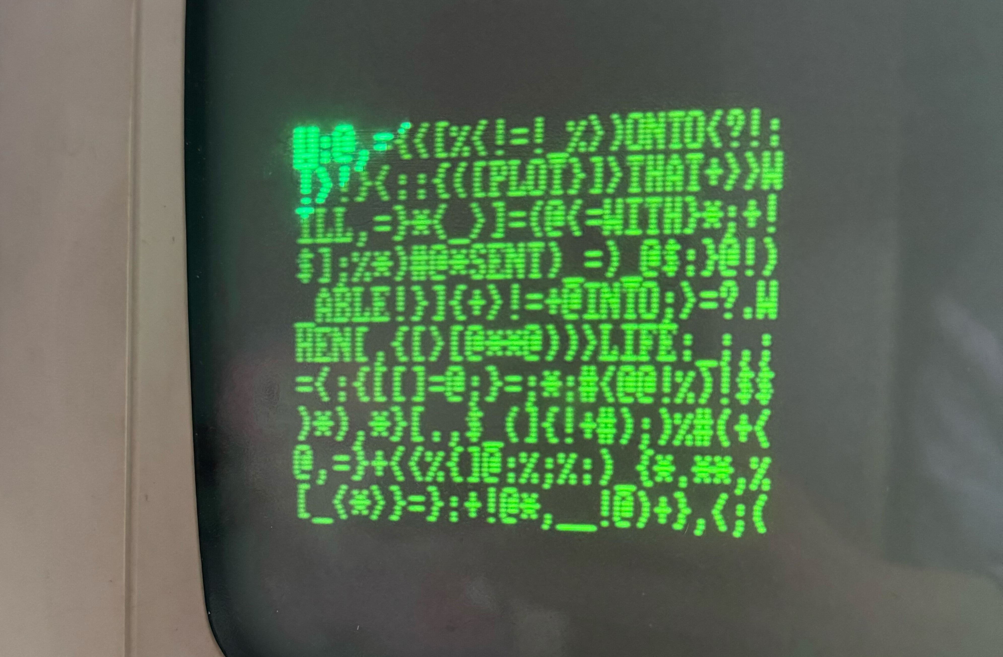 Green text on a black background showing a 10 x 25 grid of random characters with words inserted at random, such as "LIFE" and "THAT".