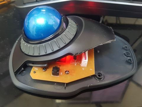 An actual photo of my trackball mouse with a badly sawn-off cover